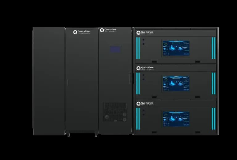 A QuettaFlow VASRack installation seen head on: a row of black cabinets beside a three tier immersion rack, each tier carrying a status display.