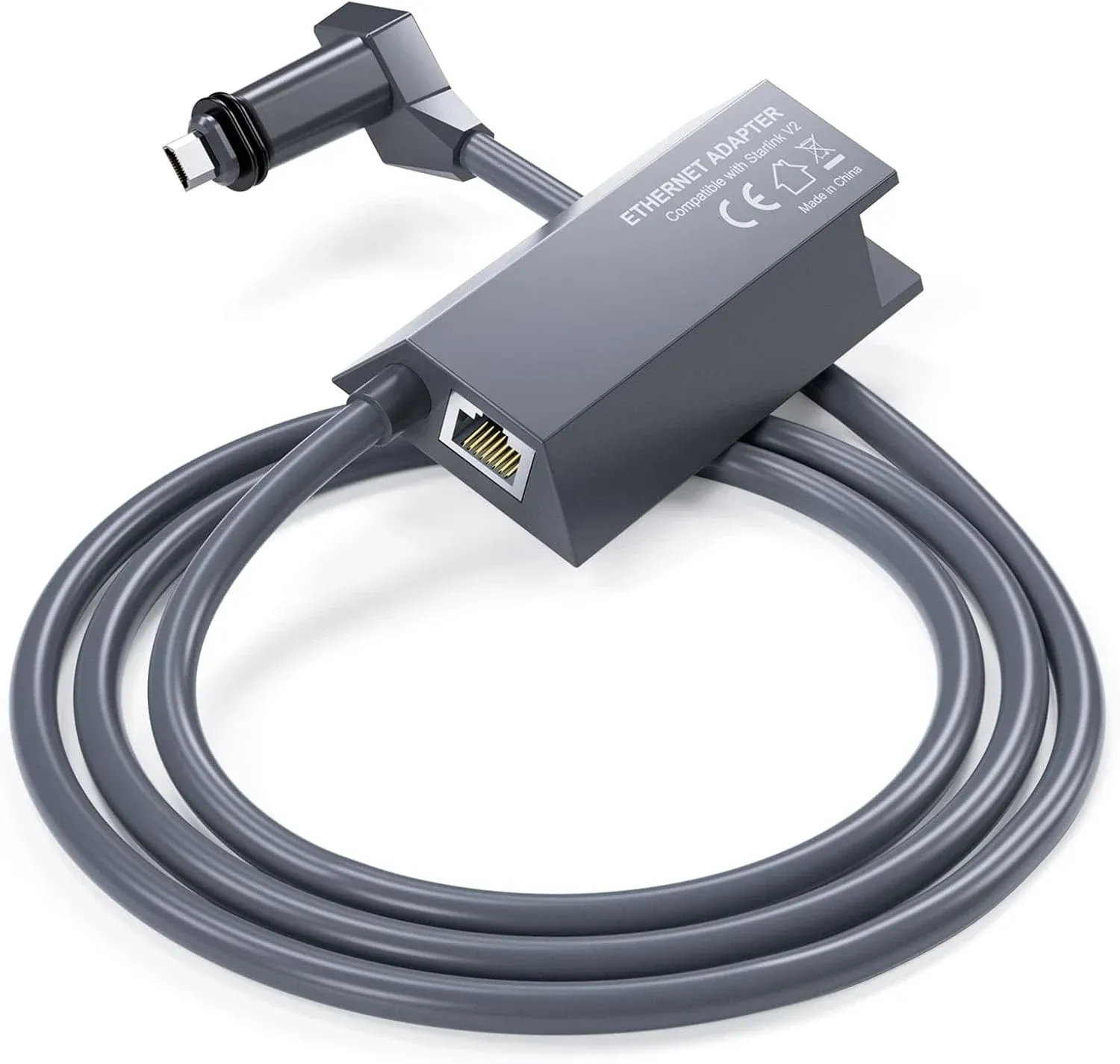 Starlink ethernet adapter, a grey inline module with an RJ45 socket, its cable coiled beneath it.