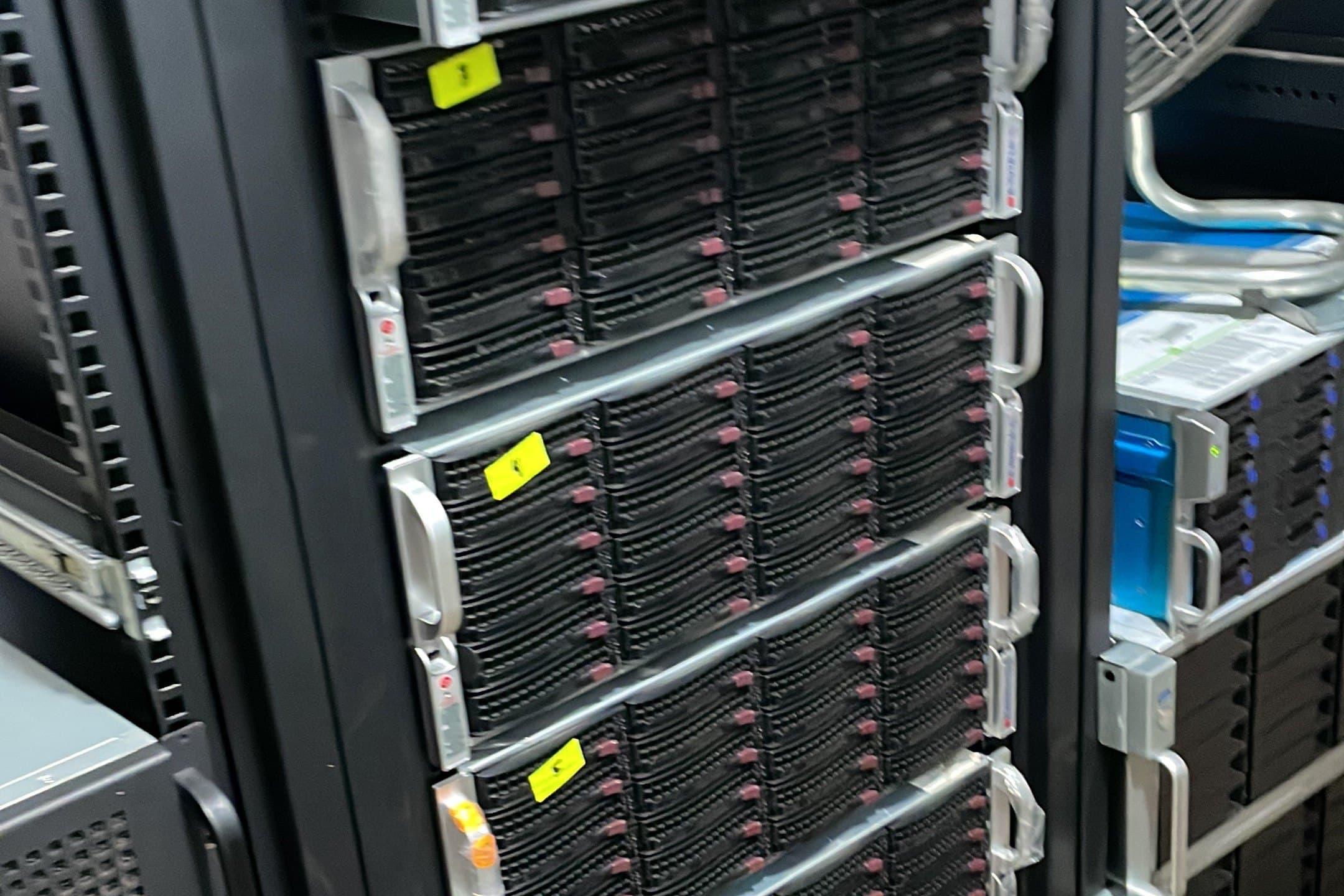 JBOD chassis stacked in a rack, front faces packed with rows of 3.5 inch drives in caddies.